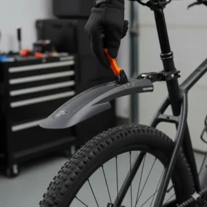 Detailed view of the quick-release lever and adjustable mechanism on a premium mtb mudguard, allowing riders to easily attach and remove the fender.