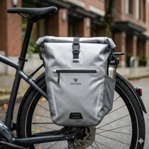 Compact electric bike handlebar bag with a transparent touchscreen sleeve for GPS navigation on an e-bike display.